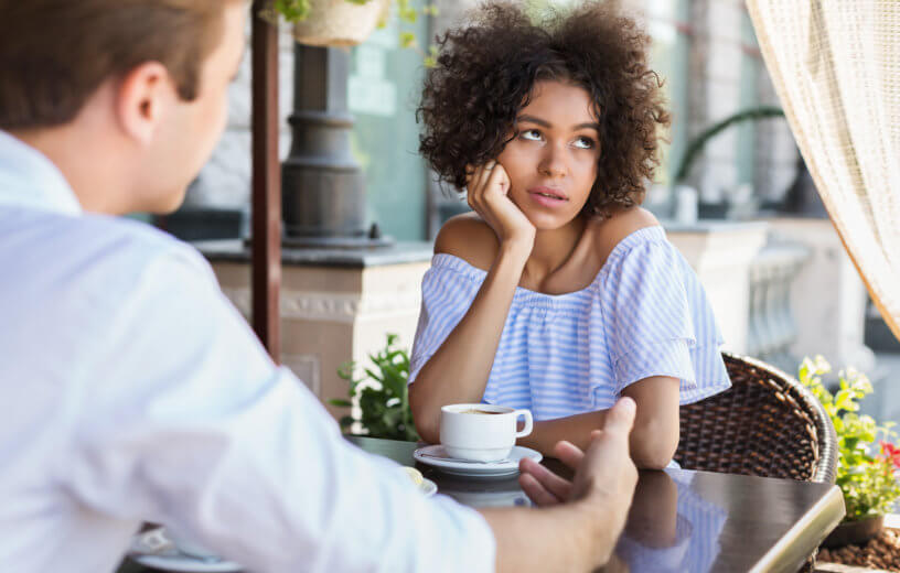 Woman disinterested while on date, upset with partner