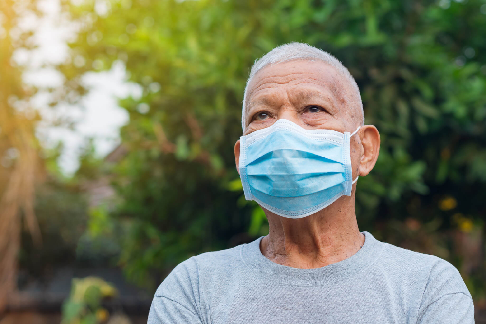 Older man wearing face mask during COVID-19 / coronavirus pandemic