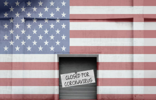 American flag storefront that says "Closed for Coronavirus"