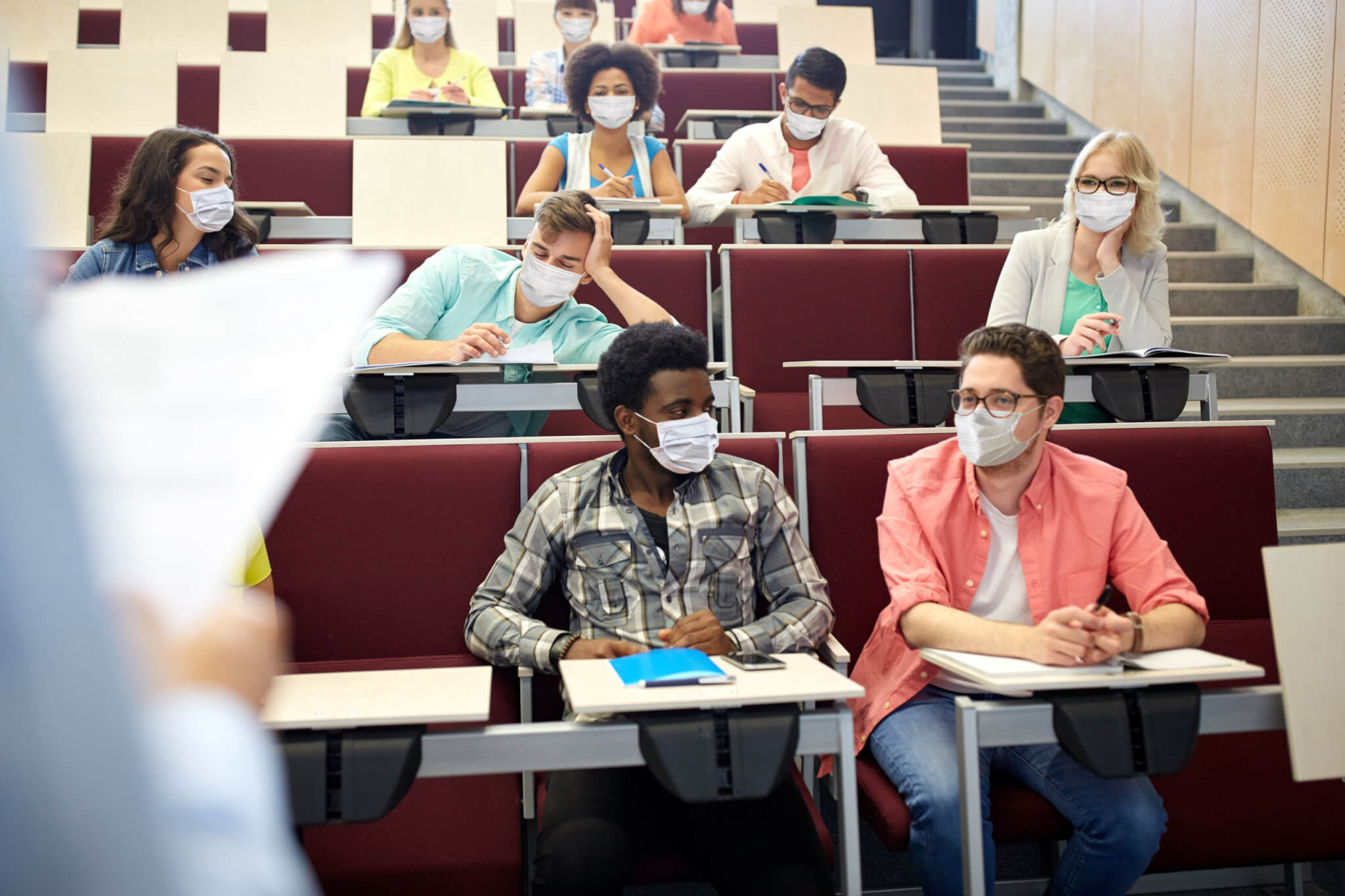 College students wearing masks during lecture for coronavirus / COVID-19 protections