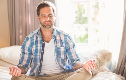 Man practicing mindfulness meditation, deep breathing