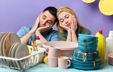 Couple laments cleaning dirty dishes