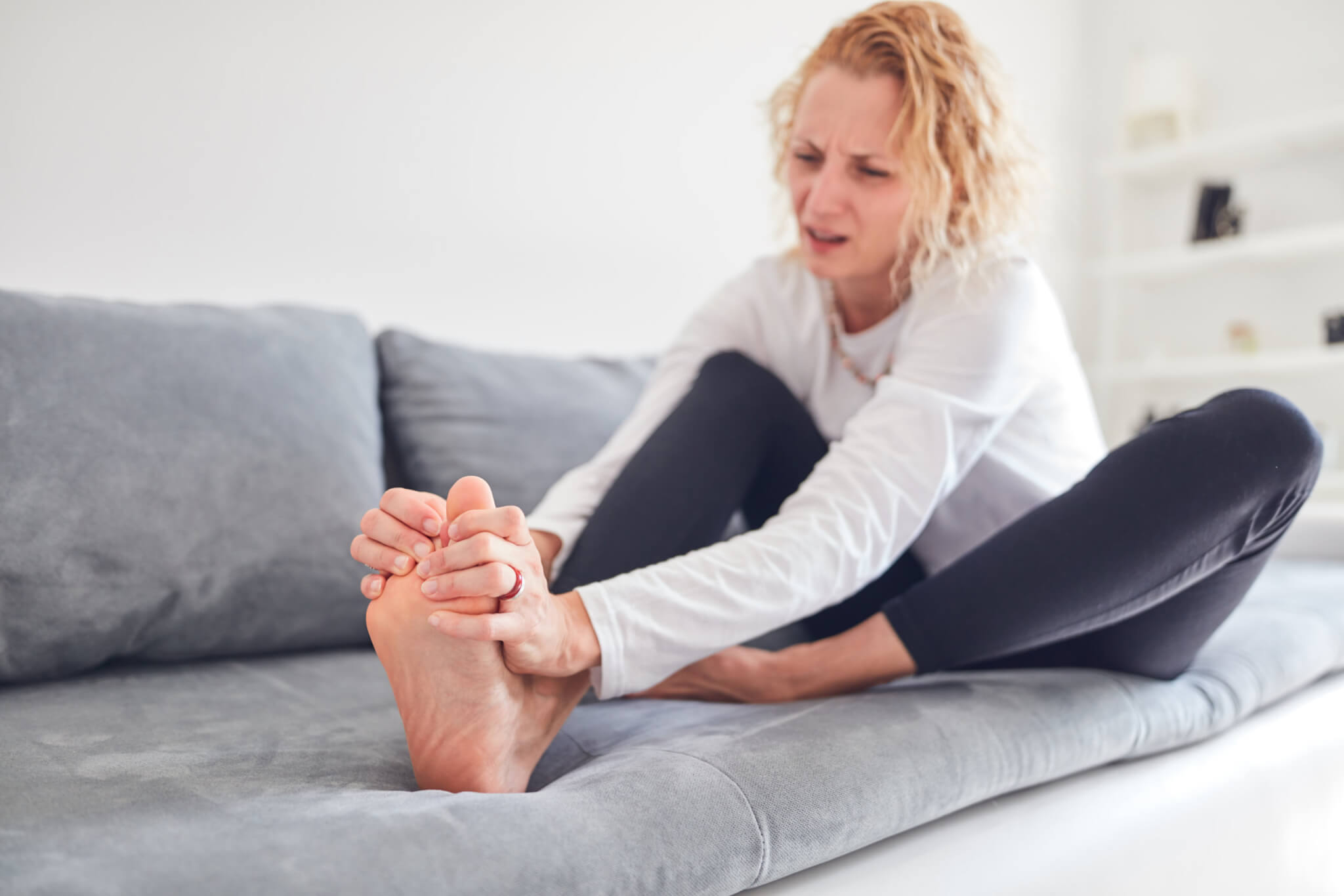 Woman with pain in her feet, joints