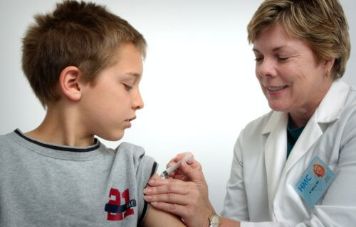 Child receiving vaccine at doctor's office