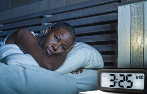 Woman suffering from insomnia, having trouble sleeping