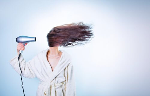 woman hair drying