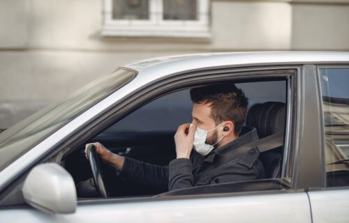 Man driving with face mask