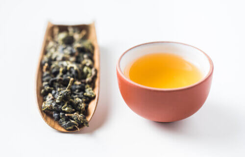 Oolong tea leaves and tea cup.
