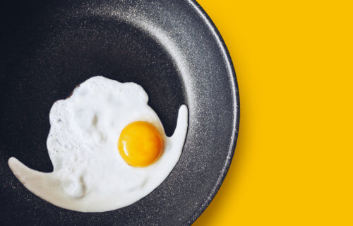 Egg being cooked on non-stick frying pan
