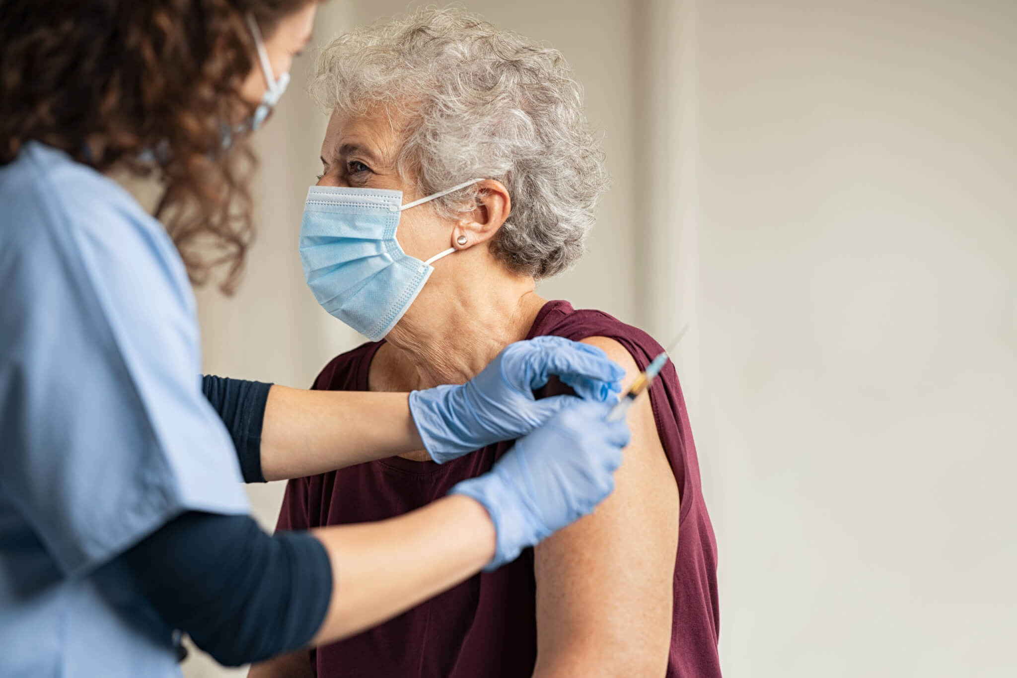 Elderly woman receiving the COVID-19 vaccine