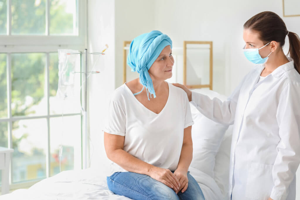 Doctor talking to cancer patient
