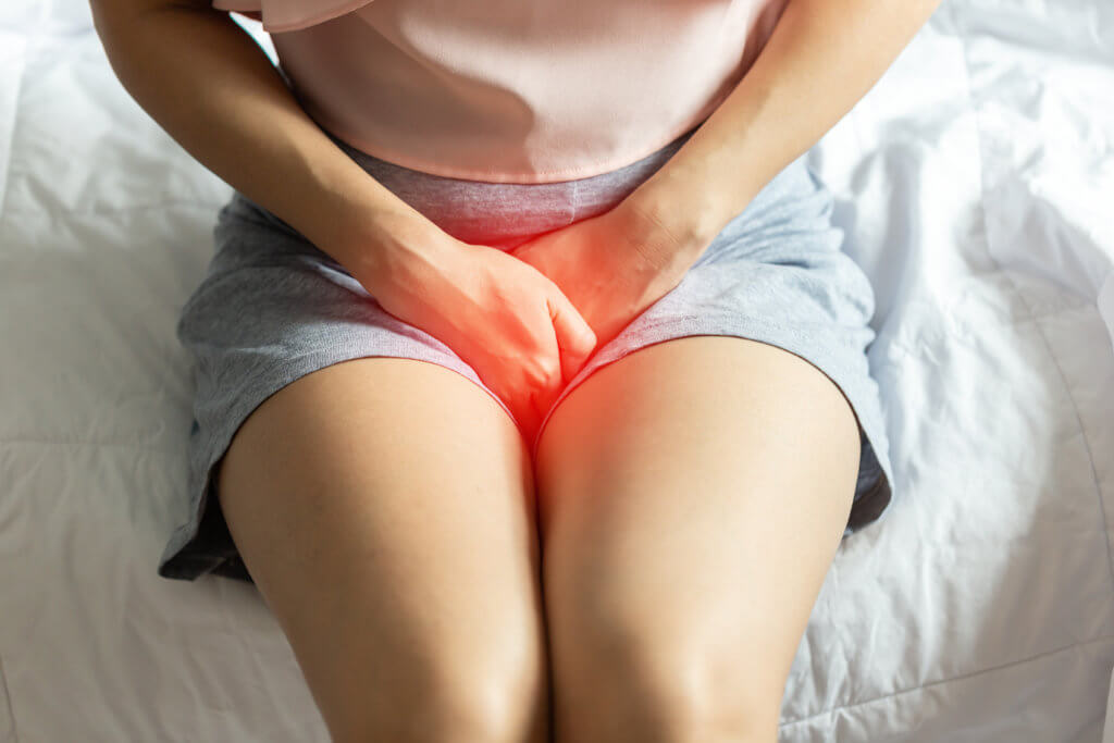 Woman suffering from UTI or bladder pain