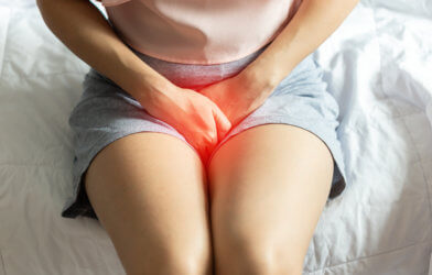 Woman suffering from UTI or bladder pain