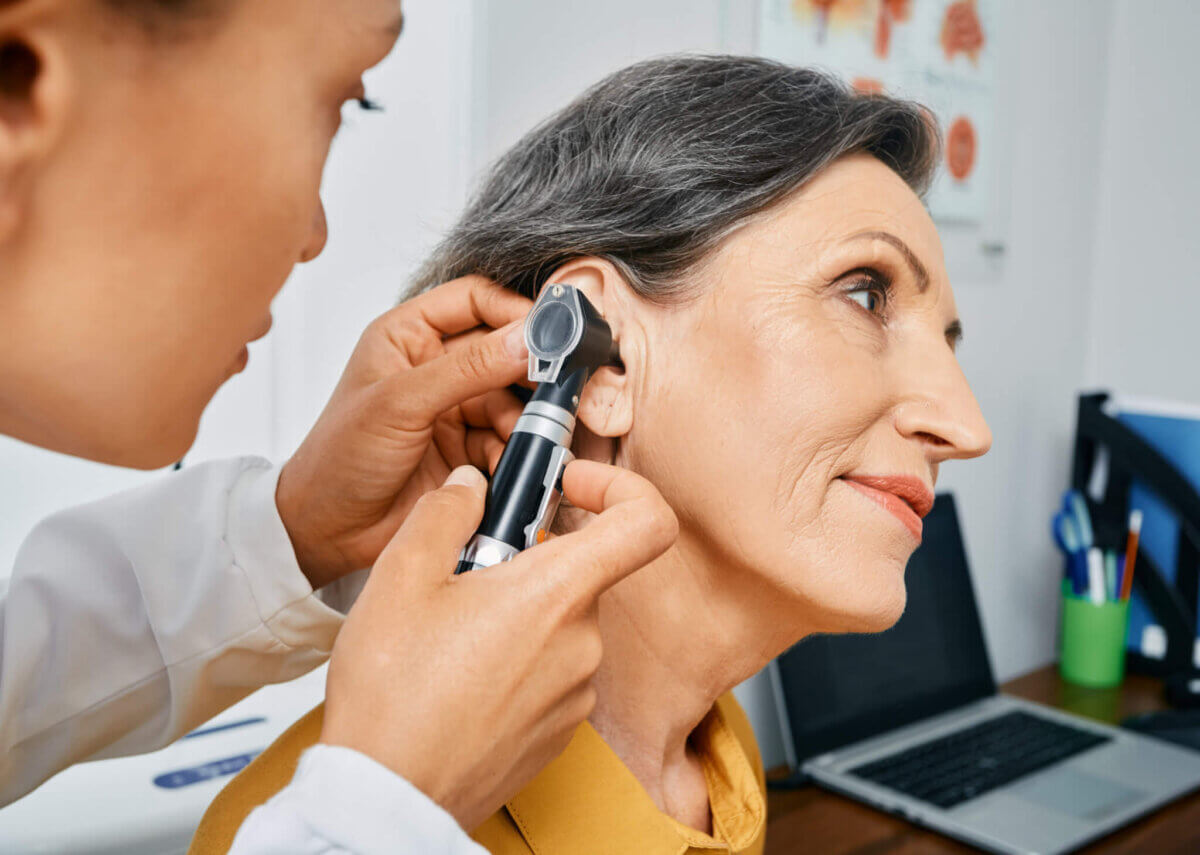 Older woman undergoing hearing test