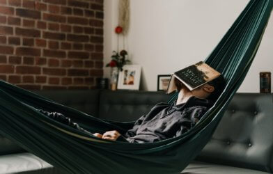 Man taking a nap in a hammock during his free time