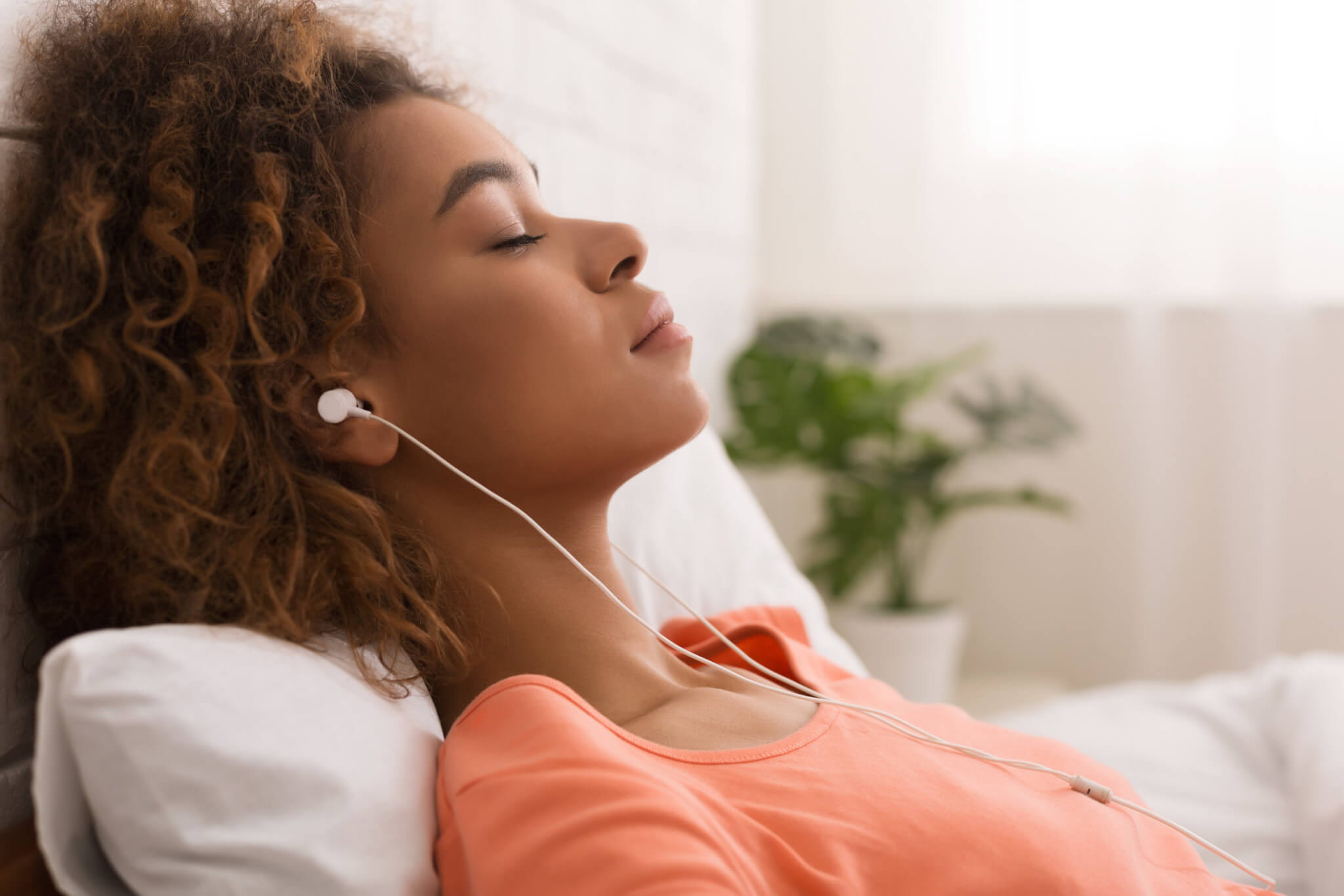 Woman listening to music, calm, relaxing, taking a nap