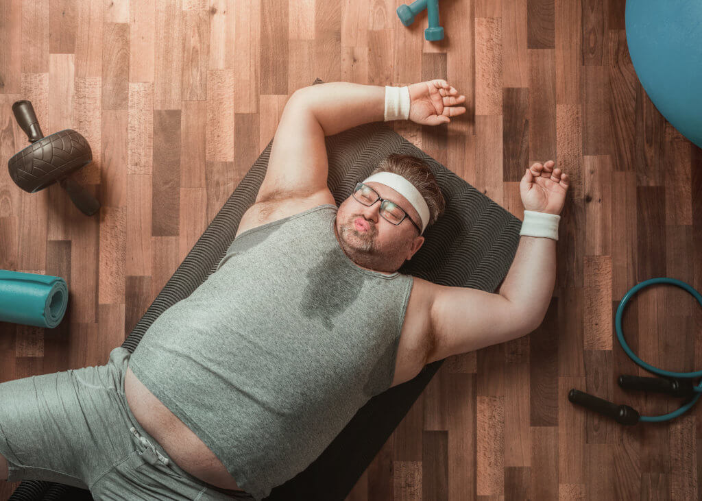 Man worn out, exhausted from exercising