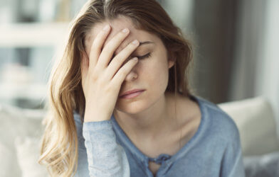 Woman stressed, headache, upset