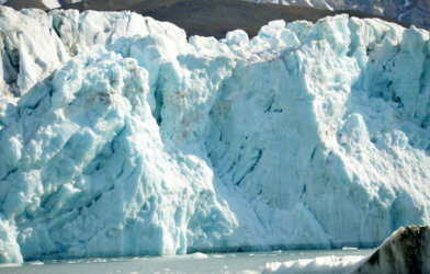 Tidewater ice glaciers receding and melting in the ocean