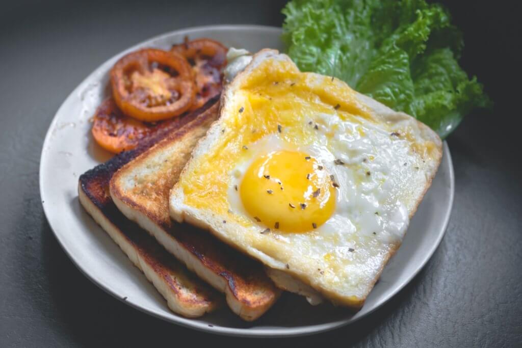 Sunny-side up eggs on toast for breakfast