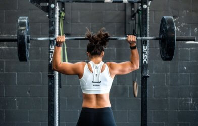 Woman lifting weights at gym