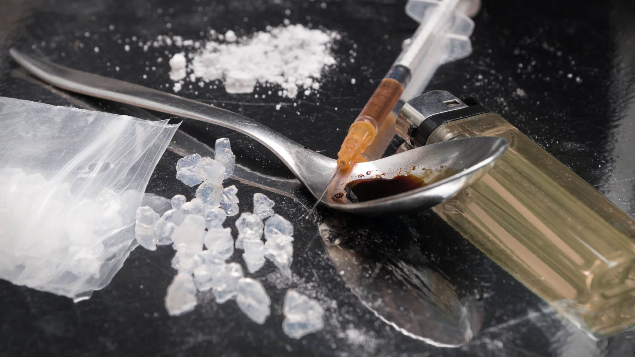 Crystal meth with needle, lighter, spoon