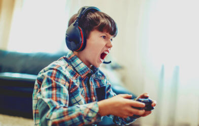 Child playing video games is angry or upset