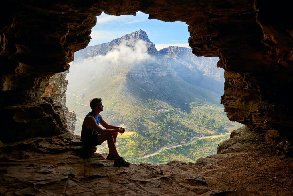 Mountain climber looking at beautiful nature scene