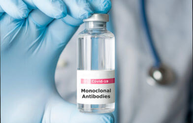 Doctor hold a vial of monoclonal antibodies to treat COVID-19