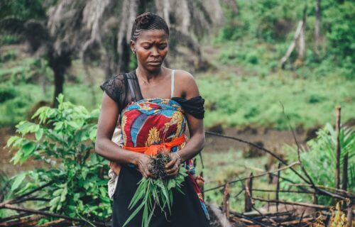 Woman works on farm in Sierra Leone.