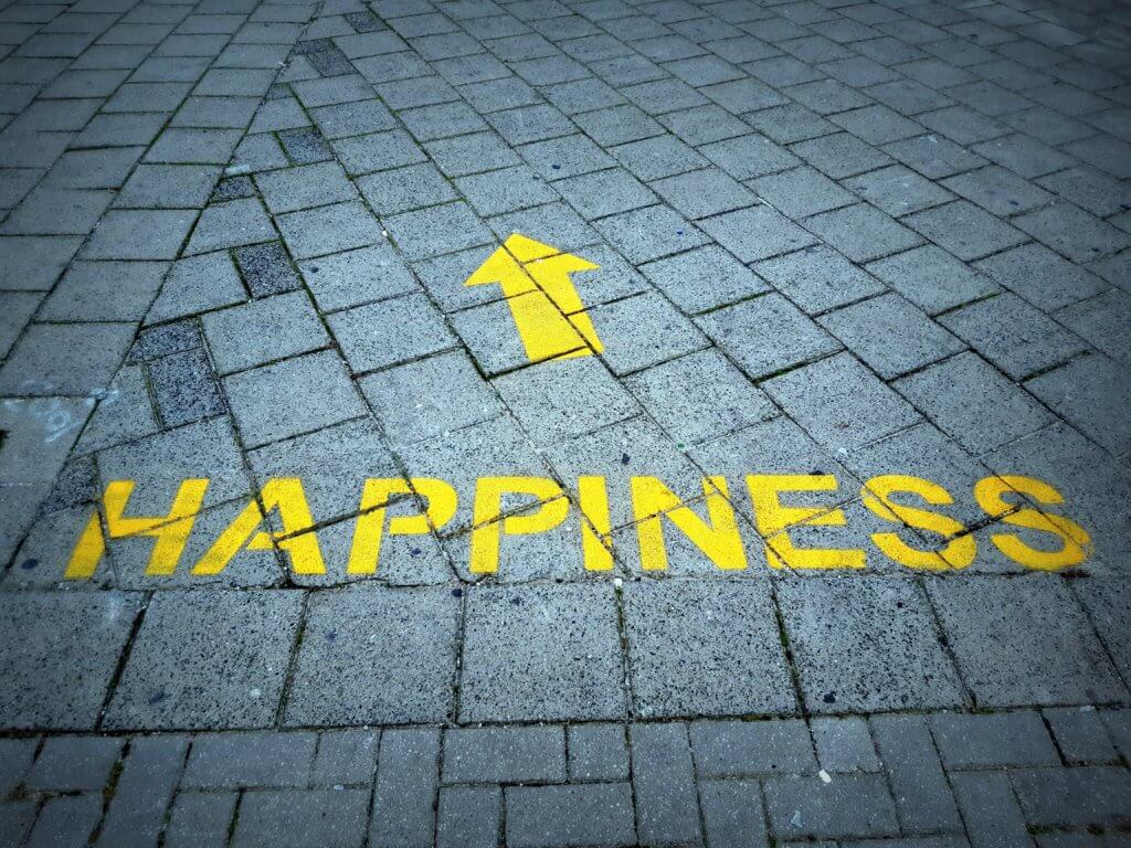 Happiness path printed on a sidewalk