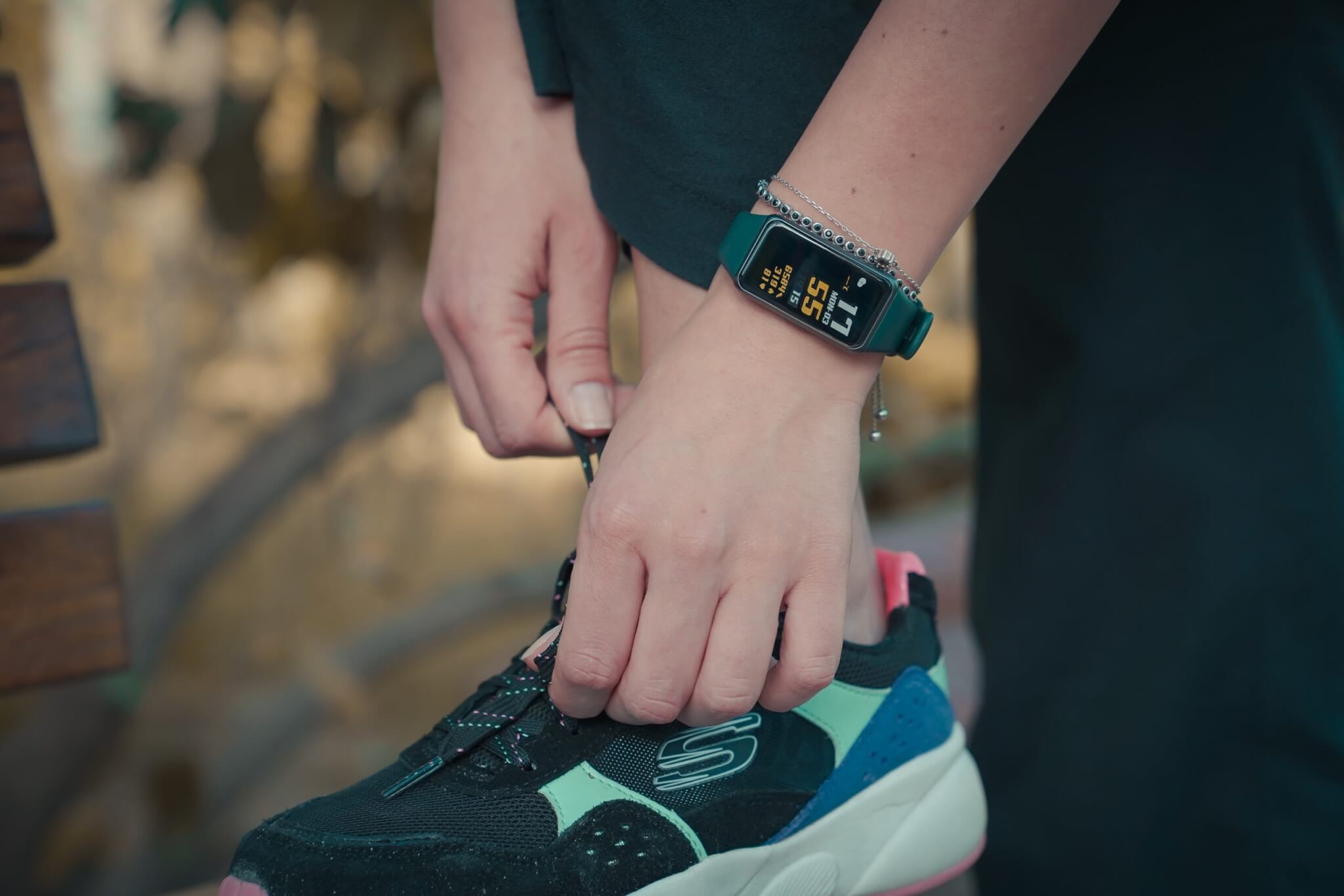 Lace-up sneakers for runners, wearing fitness trackers before exercise