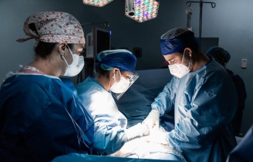 Surgeons performing surgery in the operating room