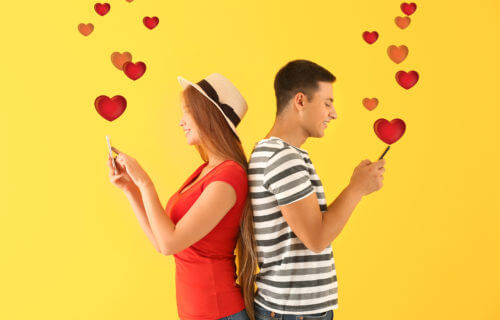 Online dating: Young couple sending messages on dating app