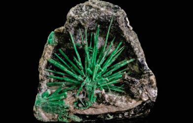 Unique environments create distinctive red, pink, blue, and green "kinds" of the mineral beryl, among them emerald