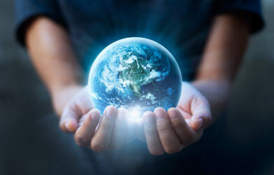 Child holding Earth in their hands.