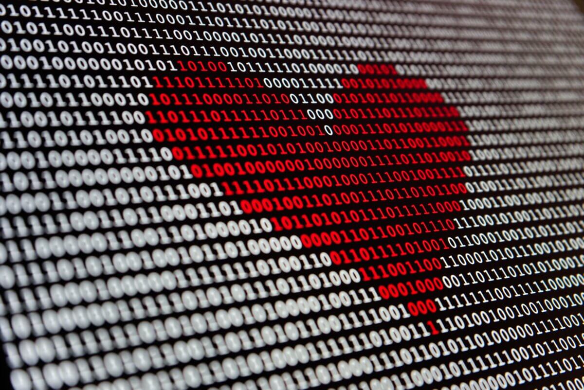 Red heart in middle of binary code