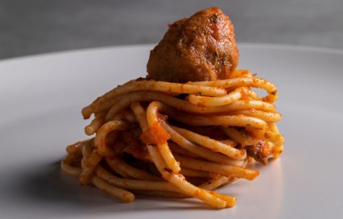 Spaghetti wrapped around a meatball.