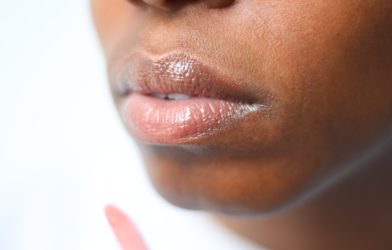 Woman's lips with lip stick or gloss on them