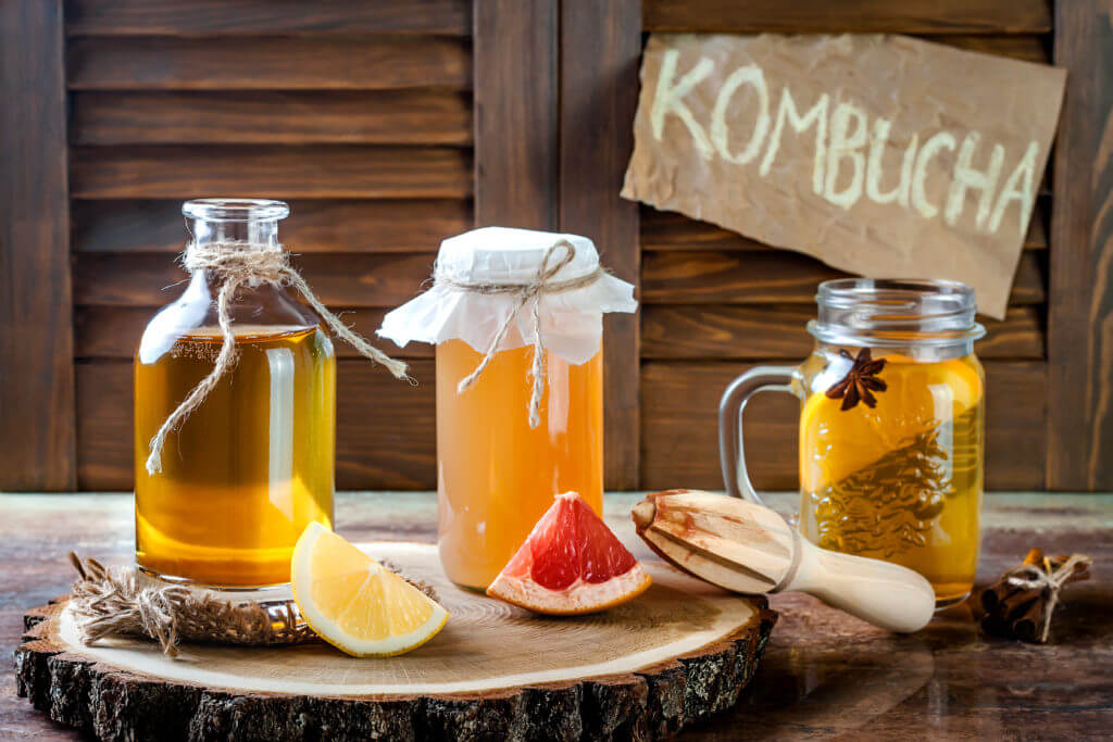 Homemade fermented raw kombucha tea with different flavorings. 
