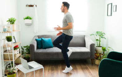 Man running in place while working at home