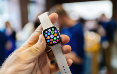 New Apple Watch Series 8 with white band.