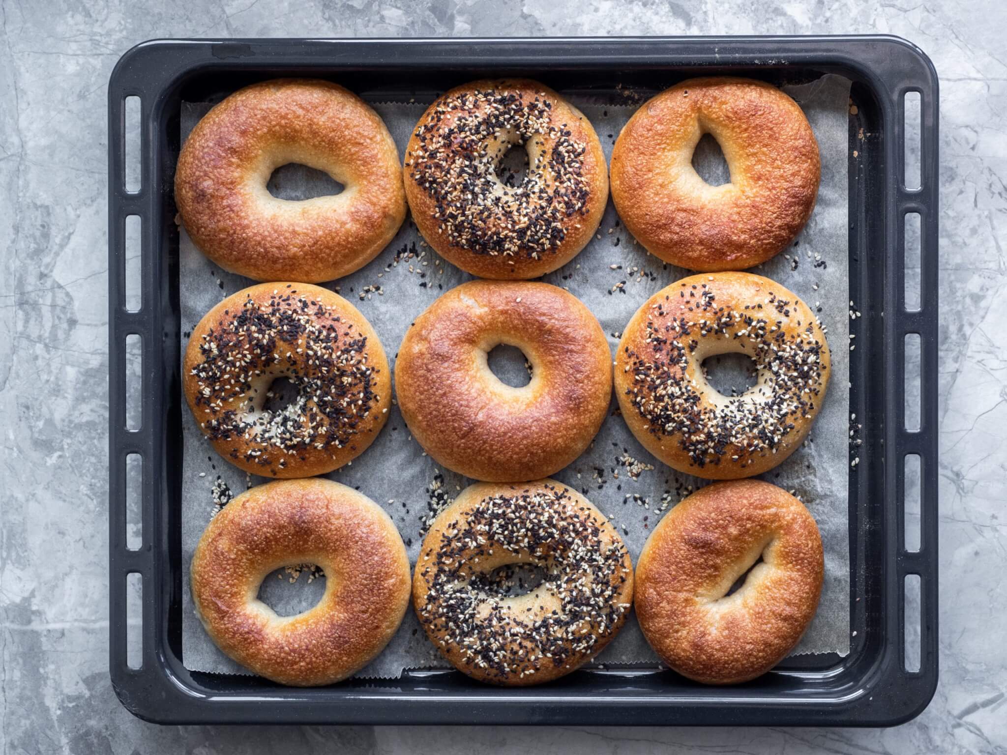Tray bagels fresh out of the oven always taste the best.