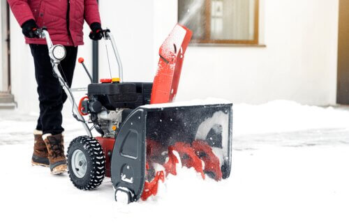 Person using a snow blower