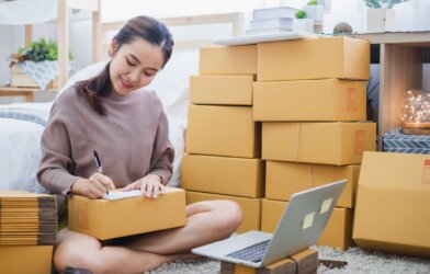 Entrepreneur sending out packages for her home business