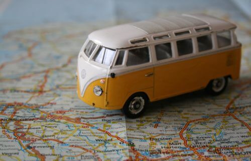 Volkswagen bus toy driving on map