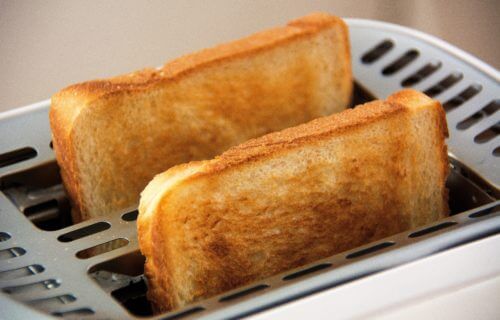 Toast popping out of a toaster.