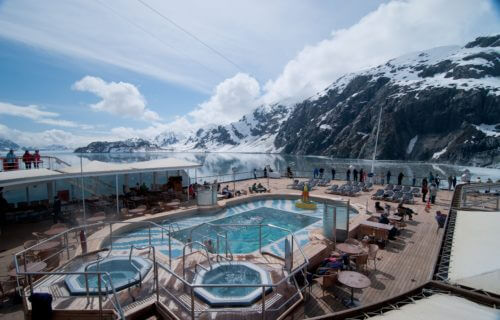 Cruise ship passengers poolside in Glacier Bay, Alaska.