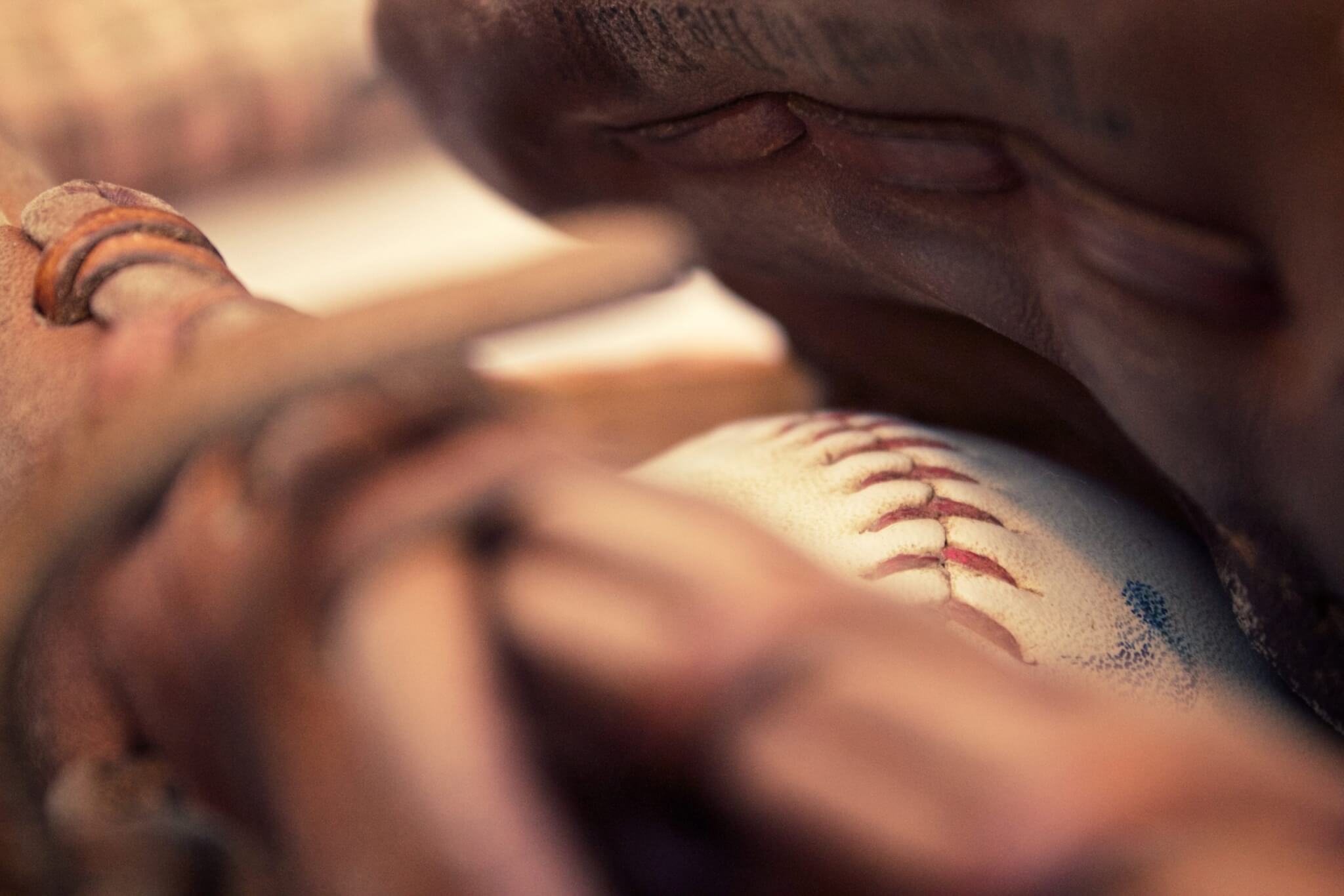 Baseball glove holding a ball