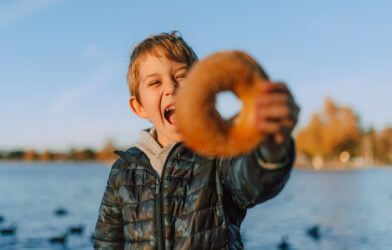 Boy holding a donut